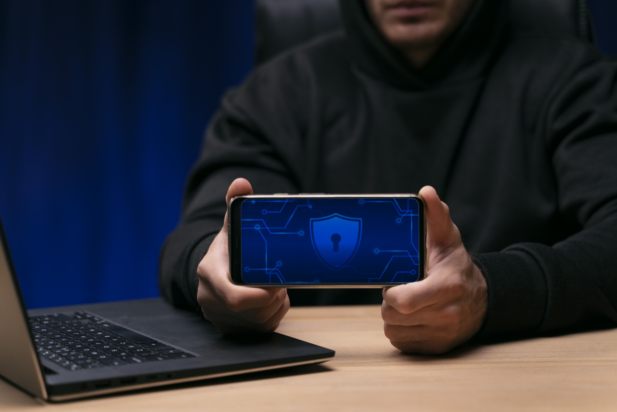 close-up-programmer-holding-phone